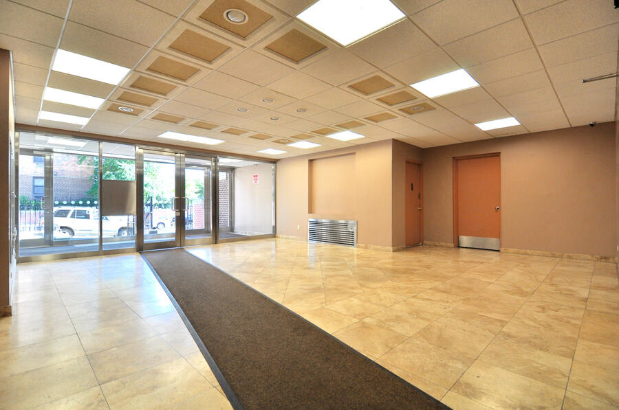 Wide lobby photograph facing the interior common area at The Olmstead